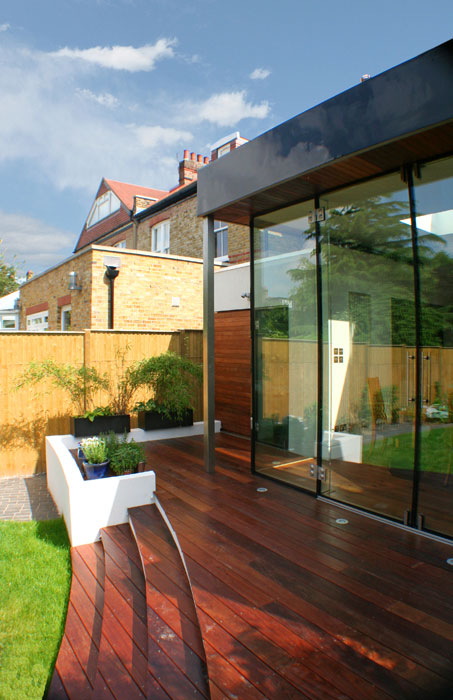 Curved deck and steps along back of house